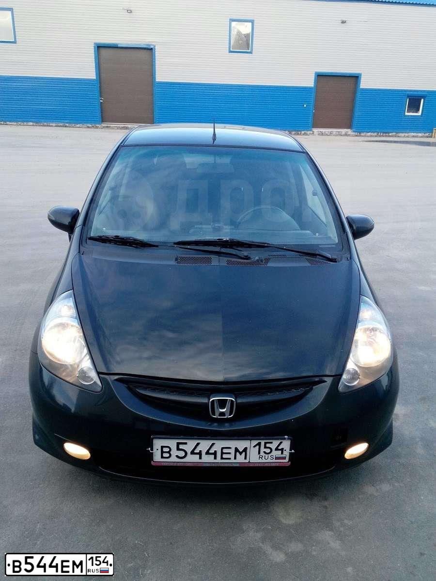 Фото автомобиля HONDA JAZZ, 2007 — госномер К573КТ70. Цвет: ЧЕРНЫЙ