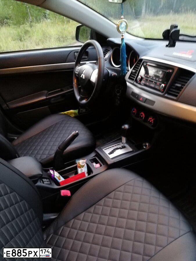 Фото автомобиля MITSUBISHI LANCER, 2014 — госномер Е543ХЕ174. Цвет: ЧЕРНЫЙ