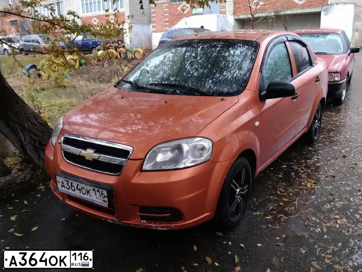 Фото автомобиля CHEVROLET AVEO, 2007 — госномер У500ЕА58. Цвет: Оранжевый