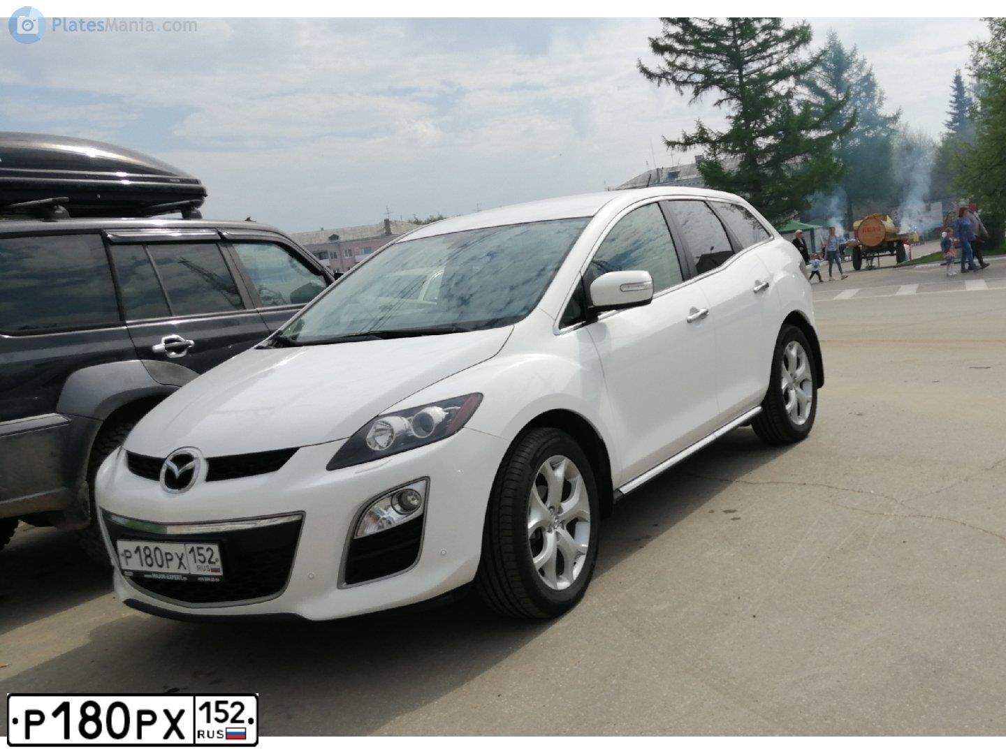 Фото автомобиля MAZDA CX-7, 2011 — госномер Е730ТК197. Цвет: Белый