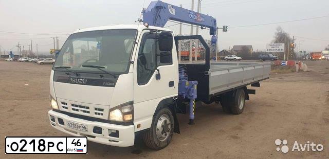 Фото автомобиля ISUZU NQR, 2009 — госномер К724ТМ199. Цвет: Белый