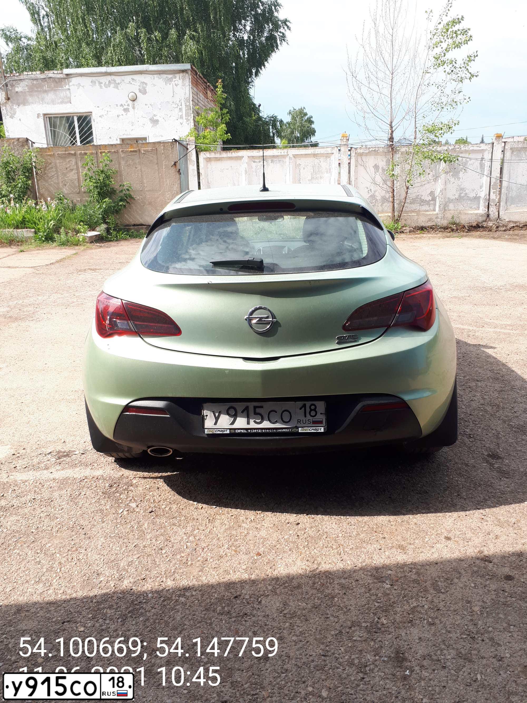 Фото автомобиля OPEL ASTRA, 2012 — госномер Е216ВМ774. Цвет: Серый