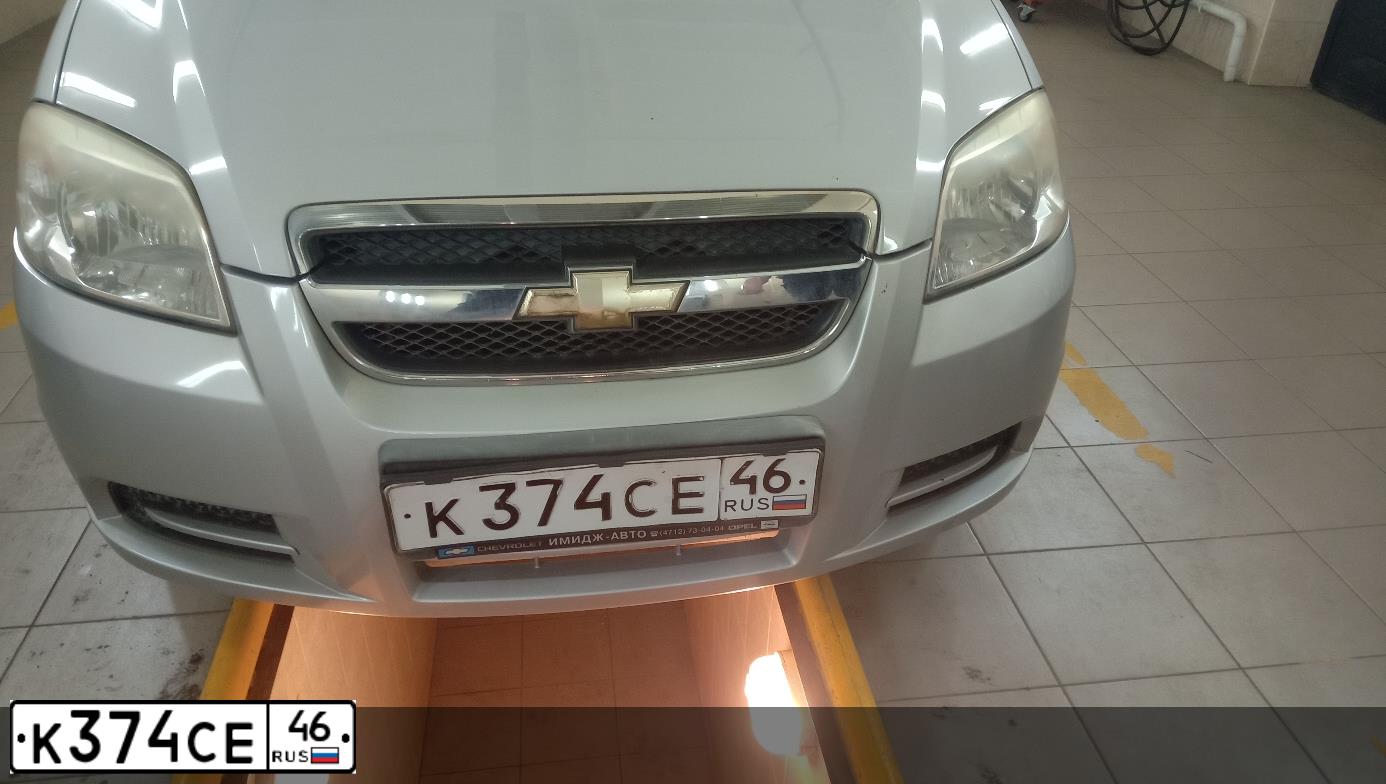Фото автомобиля CHEVROLET AVEO, 2009 — госномер К374СЕ46. Цвет: СЕРЕБРИСТЫЙ