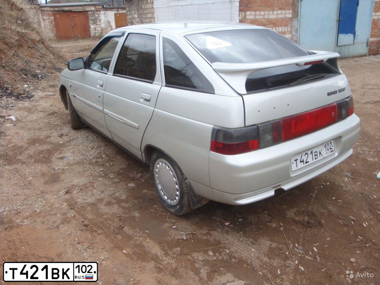 Фото автомобиля LADA 2112 LADA, 2004 — госномер Е433УР716. Цвет: МОЛОЧНО-БЕЛЫЙ СЕРЕБРИСТЫЙ