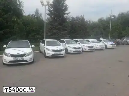 Фото автомобиля KIA RIO, 2012 — госномер Т540ОС64. Цвет: БЕЛЫЙ