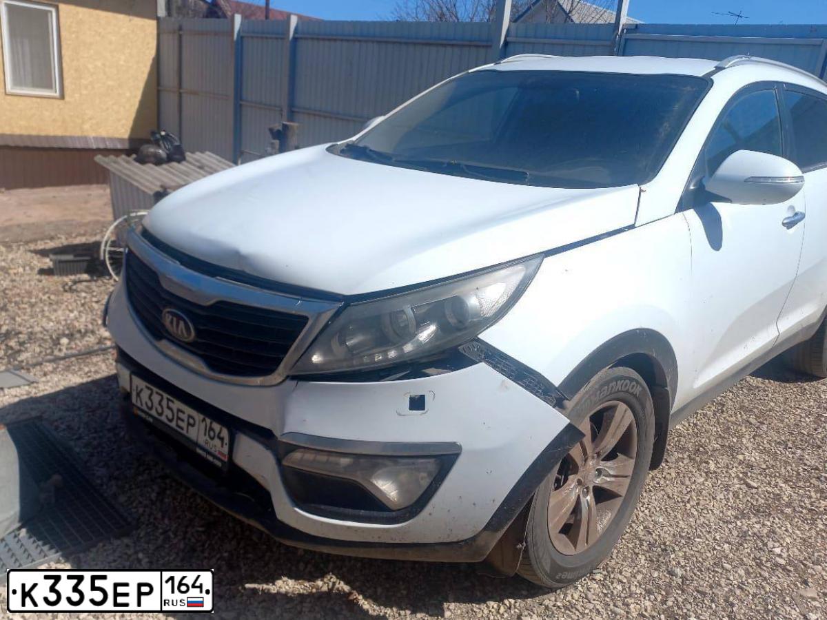 Фото автомобиля KIA SPORTAGE, 2013 — госномер К335ЕР164. Цвет: Белый
