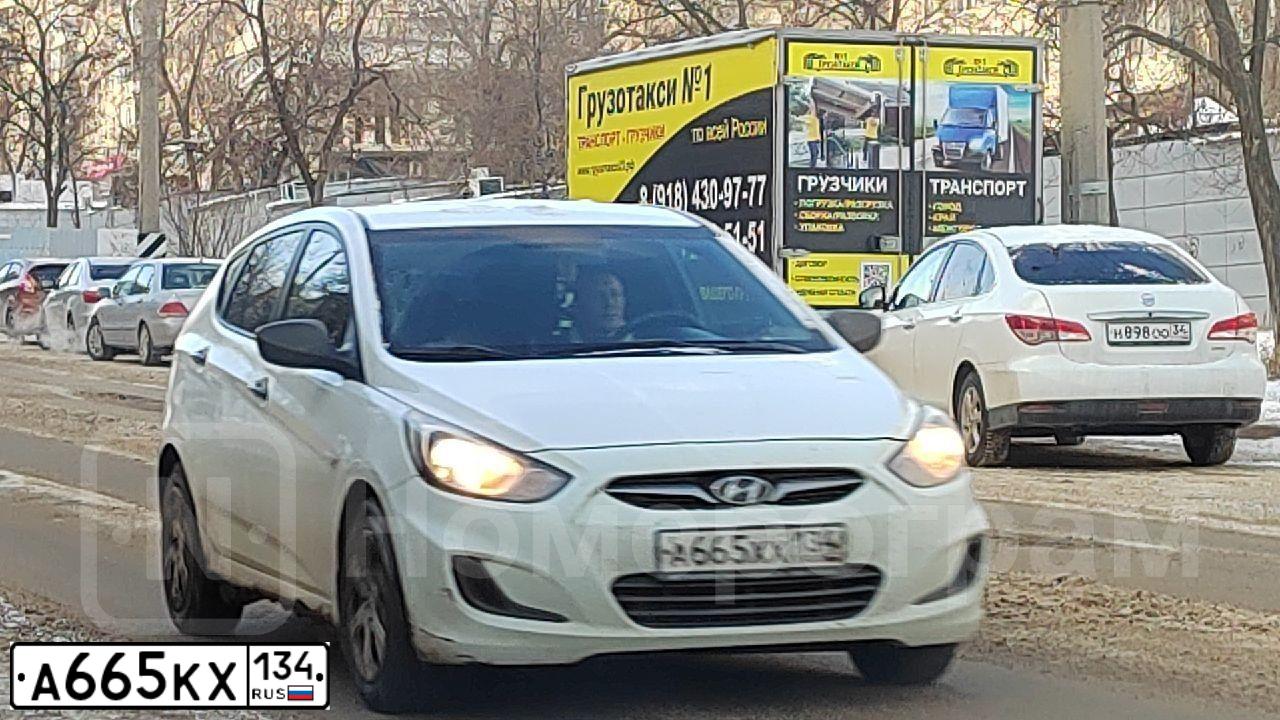 Фото автомобиля HYUNDAI SOLARIS, 2013 — госномер А665КХ134. Цвет: ЧЕРНЫЙ