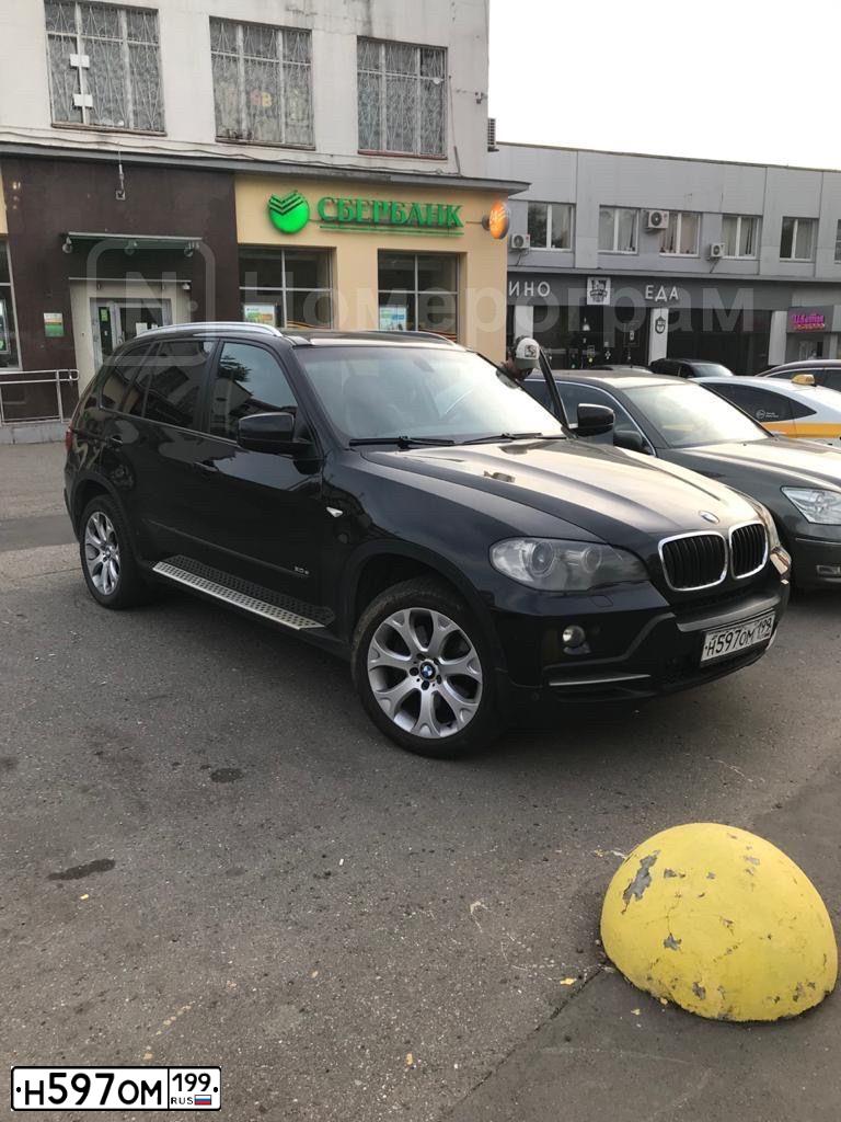 Фото автомобиля BMW X5, 2008 — госномер Н597ОМ199. Цвет: ЧЕРНЫЙ