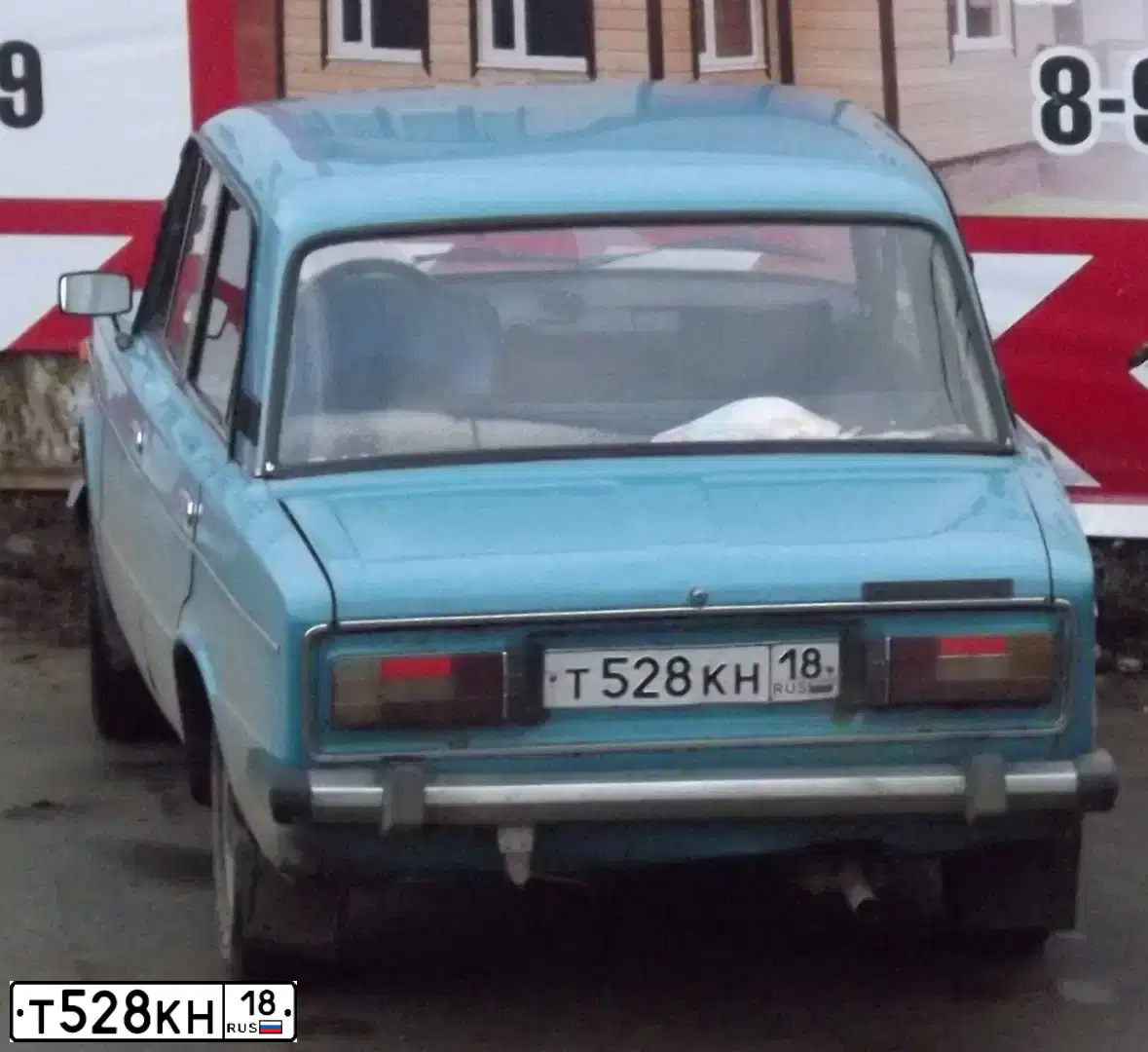Фото автомобиля NISSAN TIIDA, 2007 — госномер М026СУ18. Цвет: Красный