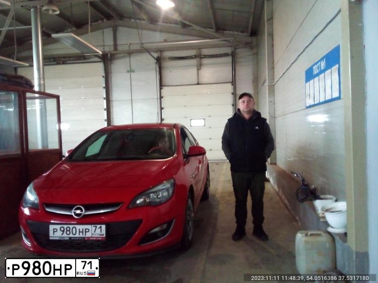 Фото автомобиля OPEL ASTRA, 2013 — госномер Р980НР71. Цвет: КРАСНЫЙ
