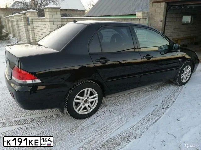 Фото автомобиля MITSUBISHI LANCER, 2006 — госномер К191КЕ164. Цвет: ЧЕРНЫЙ