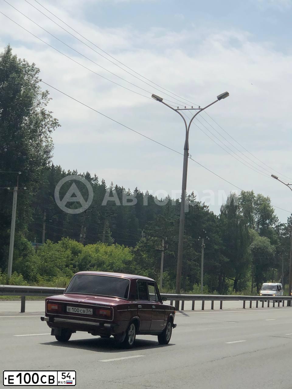 Фото автомобиля LADA 2106, 2005 — госномер Е100СВ54. Цвет: КРАСНЫЙ ПОРТУ