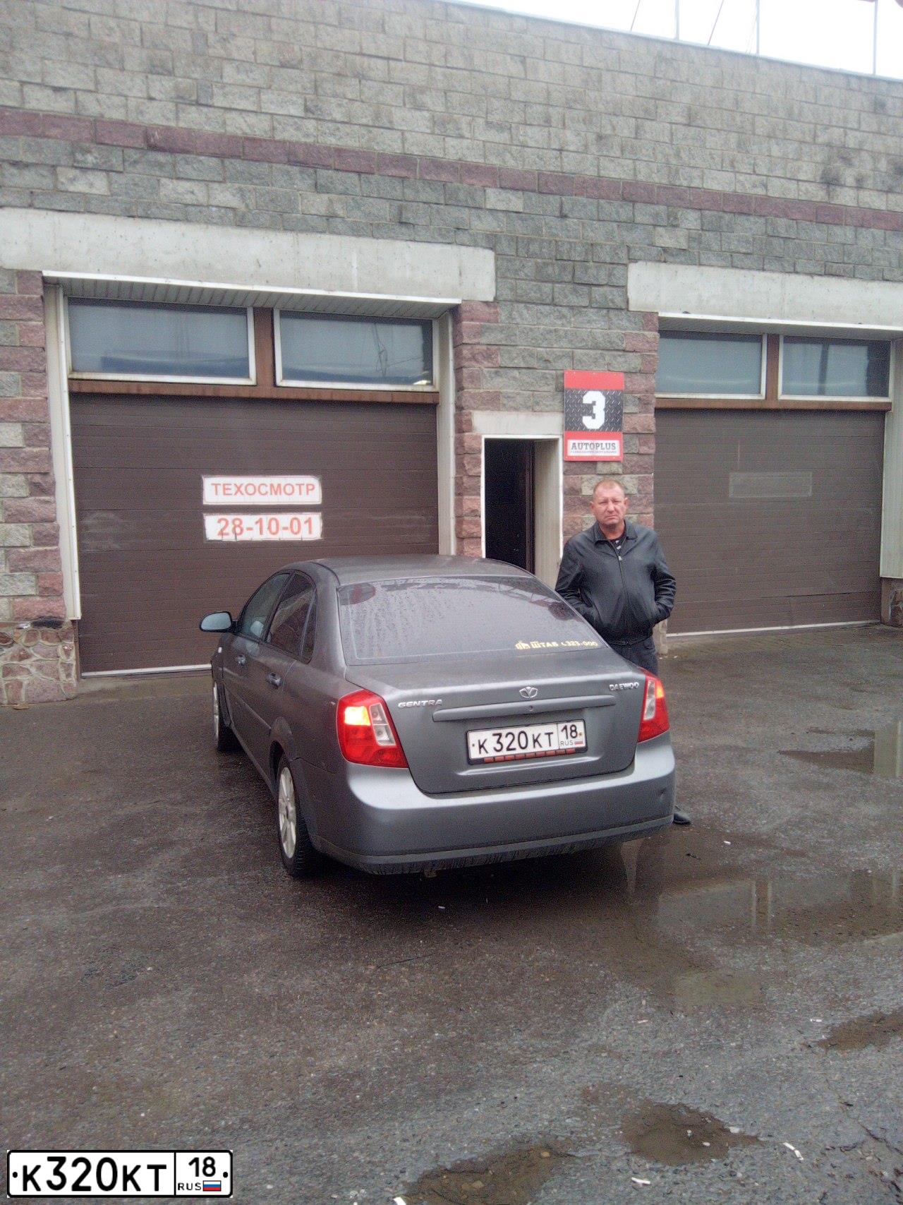 Фото автомобиля DAEWOO GENTRA, 2014 — госномер Е060РР18. Цвет: ТЕМНО-СЕРЫЙ
