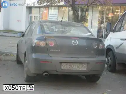 Фото автомобиля MAZDA 3, 2008 — госномер Х050ТЕ150. Цвет: СЕРЫЙ