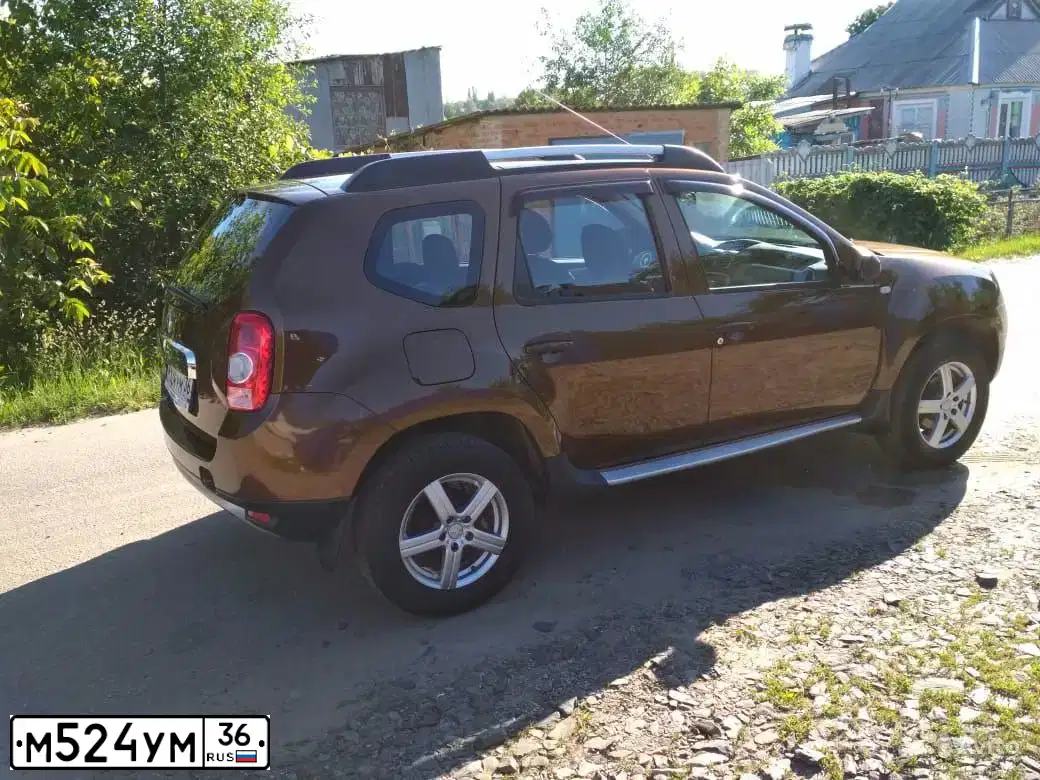 Фото автомобиля RENAULT DUSTER, 2012 — госномер М524УМ36. Цвет: КОРИЧНЕВЫЙ