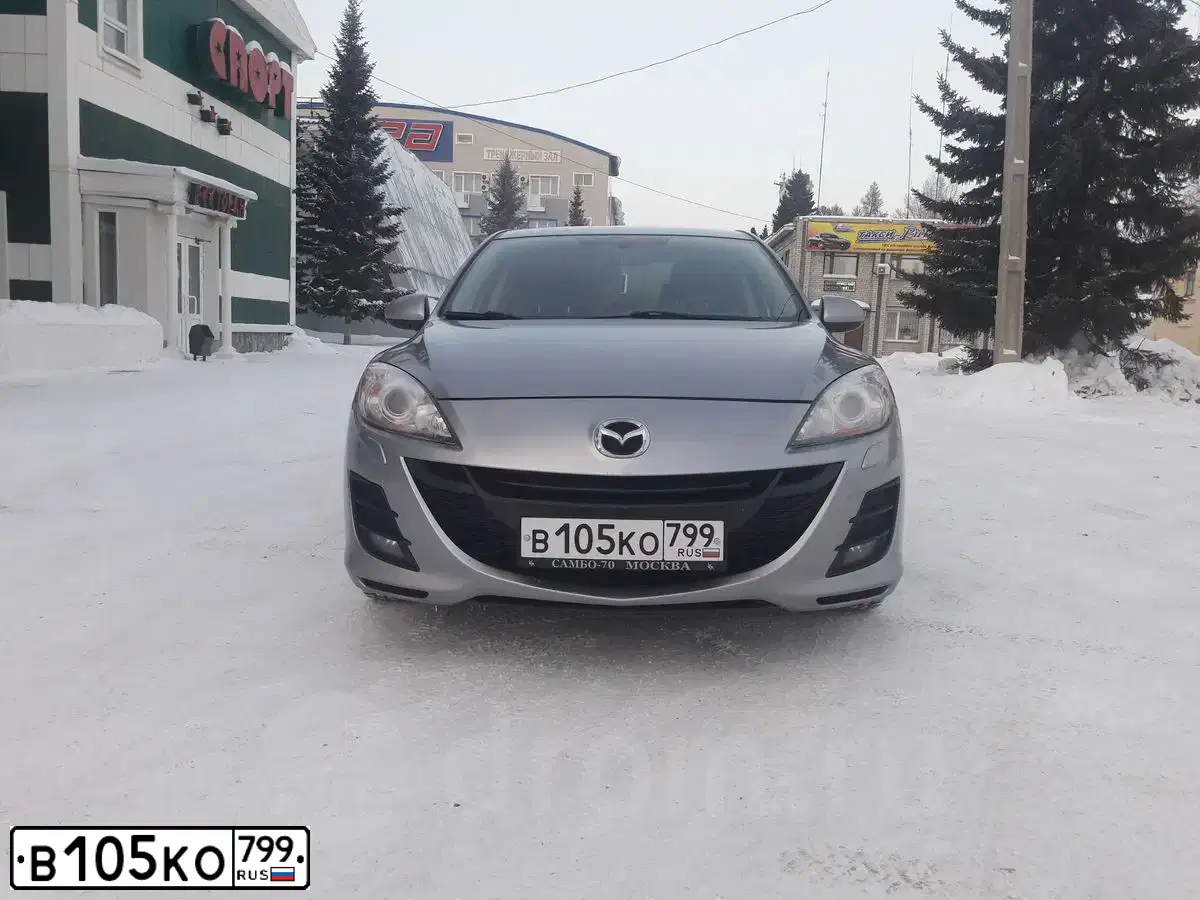 Фото автомобиля MAZDA A 3, 2011 — госномер С595МВ197. Цвет: Серебристый