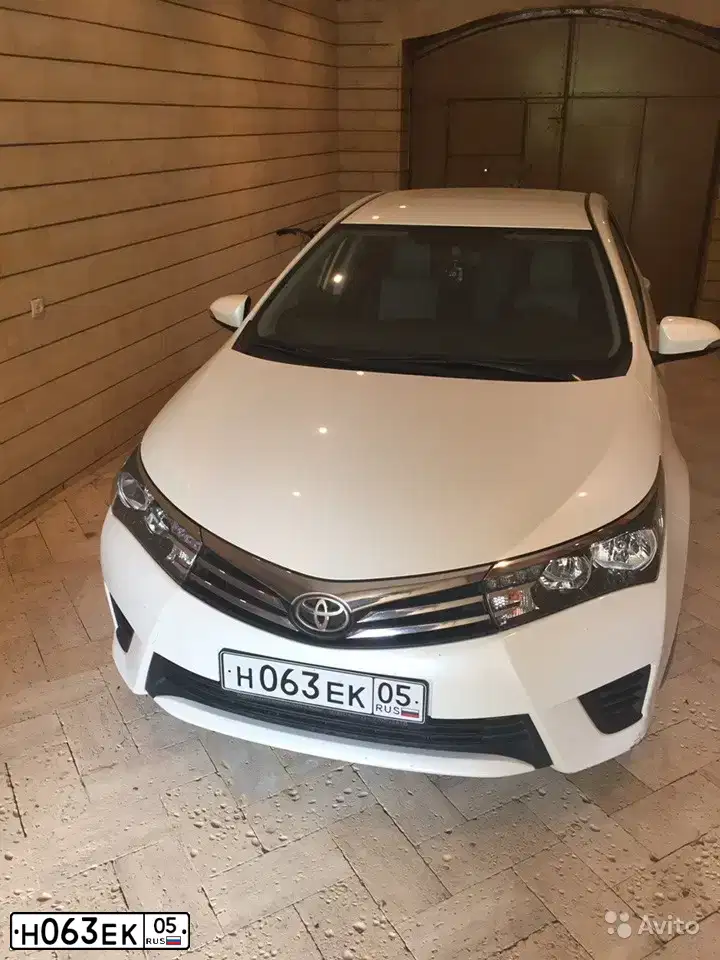 Фото автомобиля TOYOTA COROLLA, 2013 — госномер Н063ЕК05. Цвет: Белый