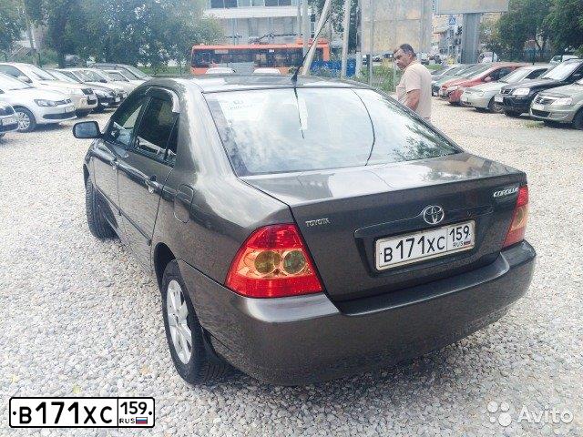 Фото автомобиля TOYOTA COROLLA, 2004 — госномер Р404РУ72. Цвет: ТЕМНО-СЕРЫЙ