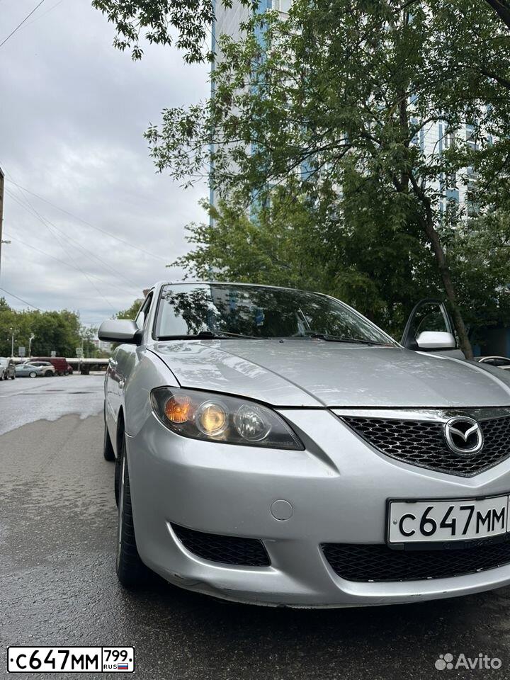 Фото автомобиля MAZDA 3, 2005 — госномер С647ММ799. Цвет: Серебристый