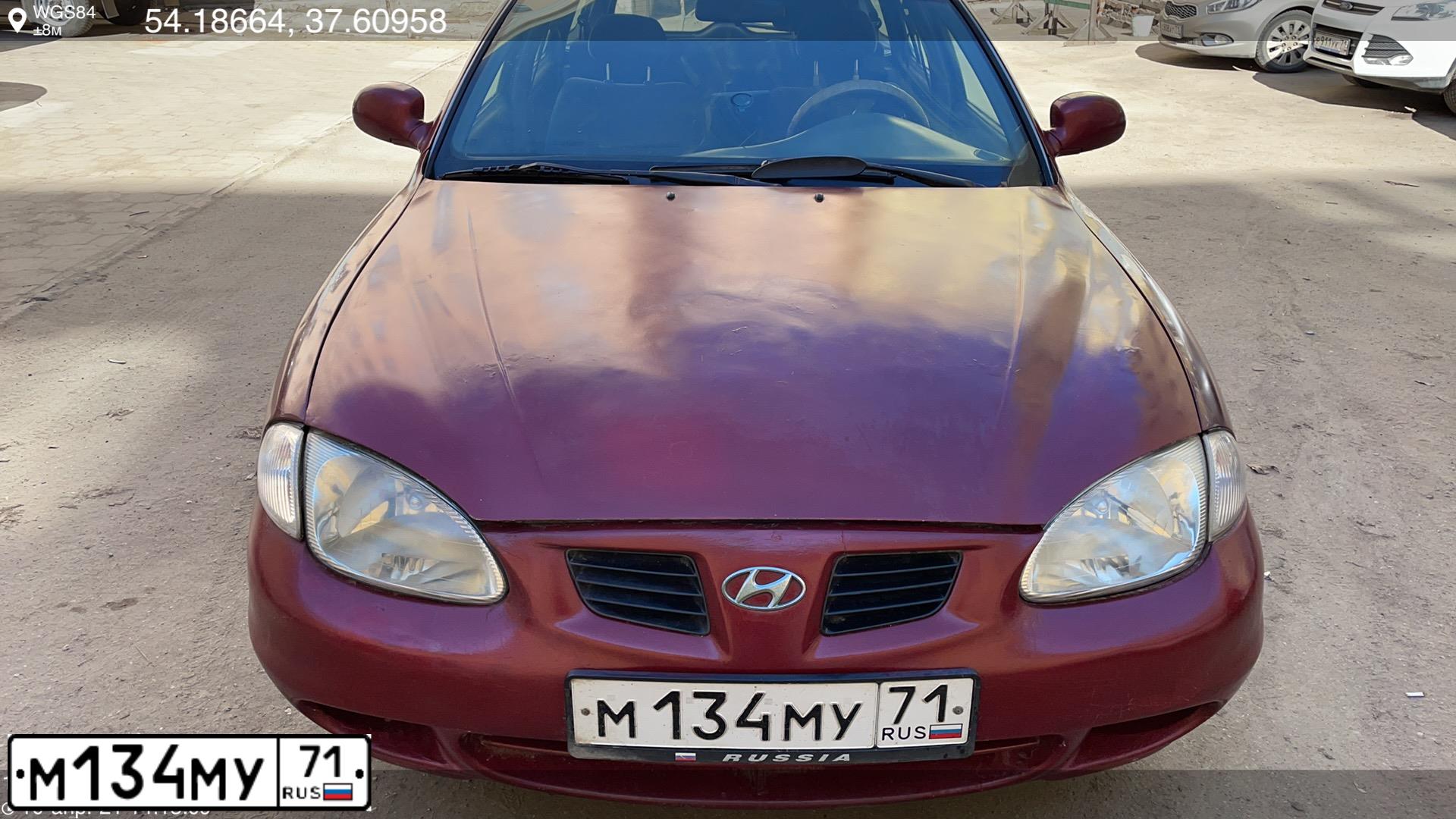 Фото автомобиля HYUNDAI LANTRA, 1999 — госномер М134МУ71. Цвет: ТЕМНО-КРАСНЫЙ