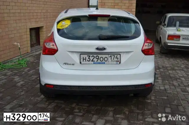 Фото автомобиля FORD FOCUS, 2012 — госномер Т386ХА72. Цвет: Белый