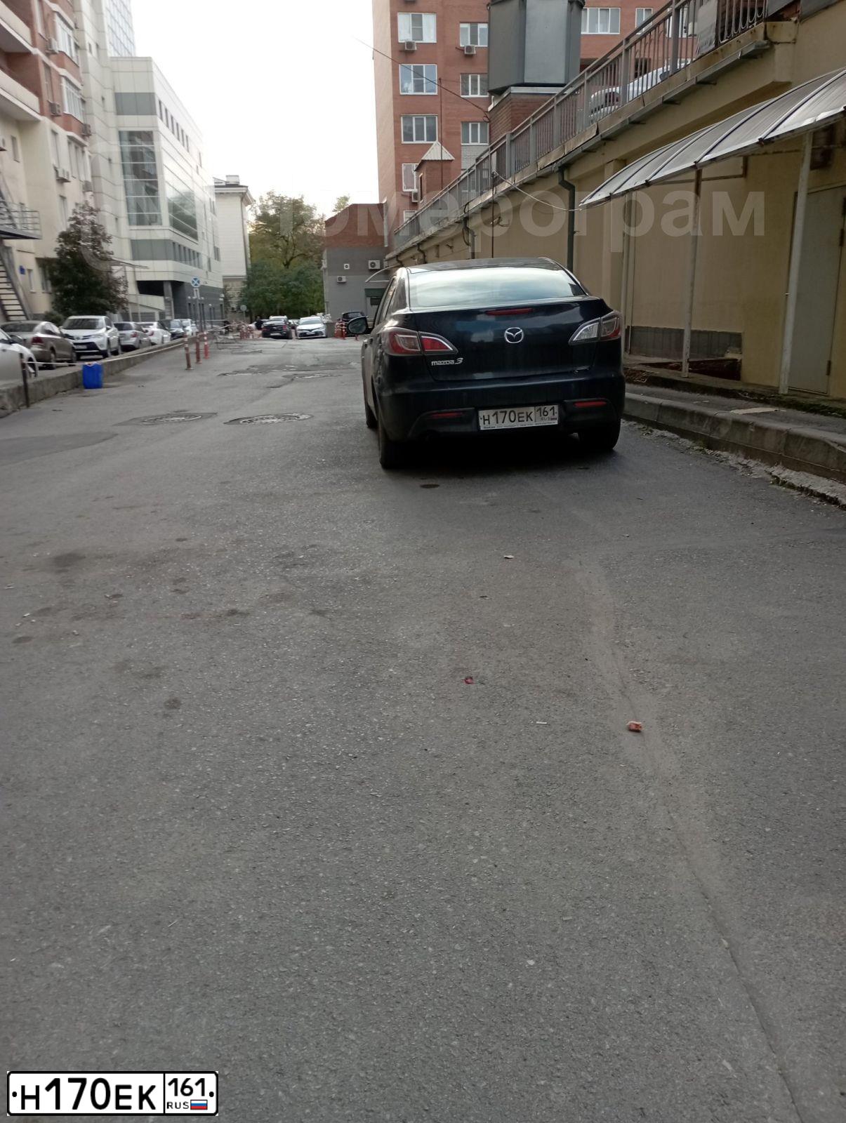 Фото автомобиля MAZDA 3, 2010 — госномер Н170ЕК161. Цвет: ЧЕРНЫЙ