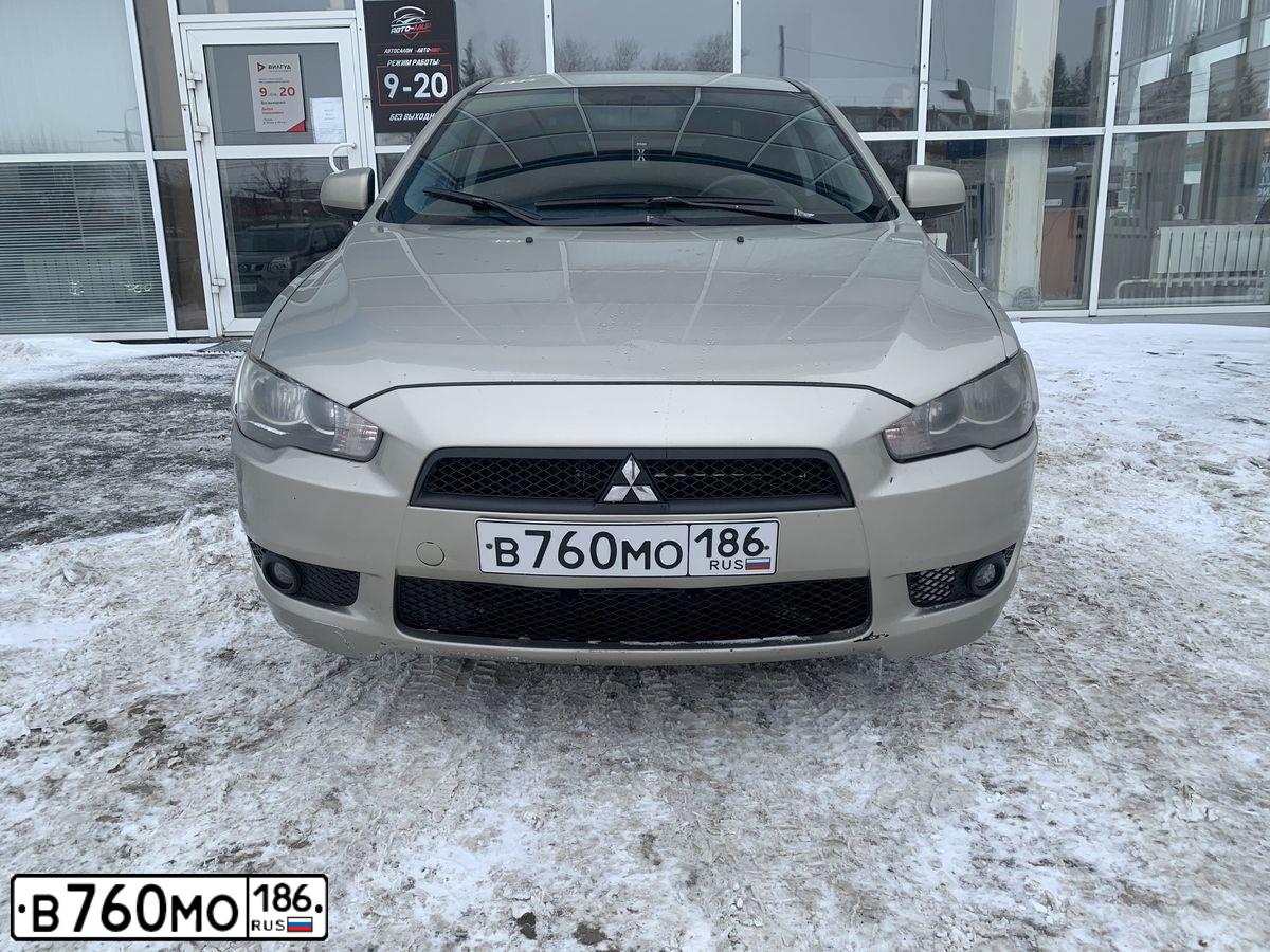 Фото автомобиля MITSUBISHI LANCER, 2007 — госномер Х237НЕ55. Цвет: БЕЖЕВЫЙ