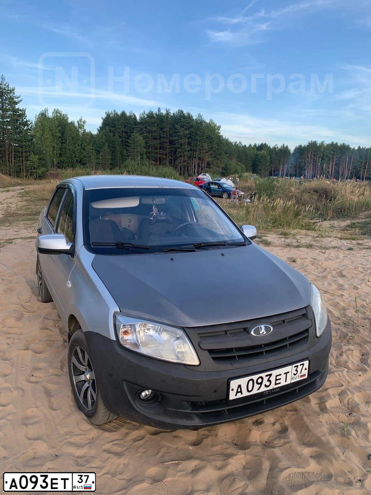 Фото автомобиля LADA 2190 GRANTA, 2012 — госномер Е012УУ33. Цвет: Серебристый