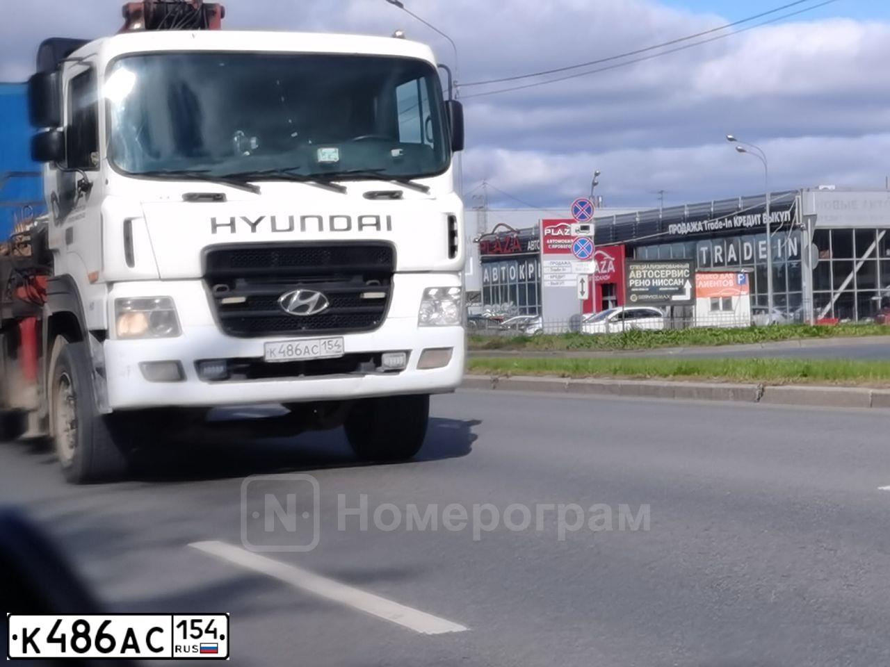 Фото автомобиля HYUNDAI HD MEGA TRUCK, 2011 — госномер К486АС154. Цвет: Белый