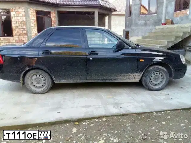 Фото автомобиля LADA 2170 PRIORA, 2015 — госномер Т111ОЕ777. Цвет: ЧЕРНЫЙ