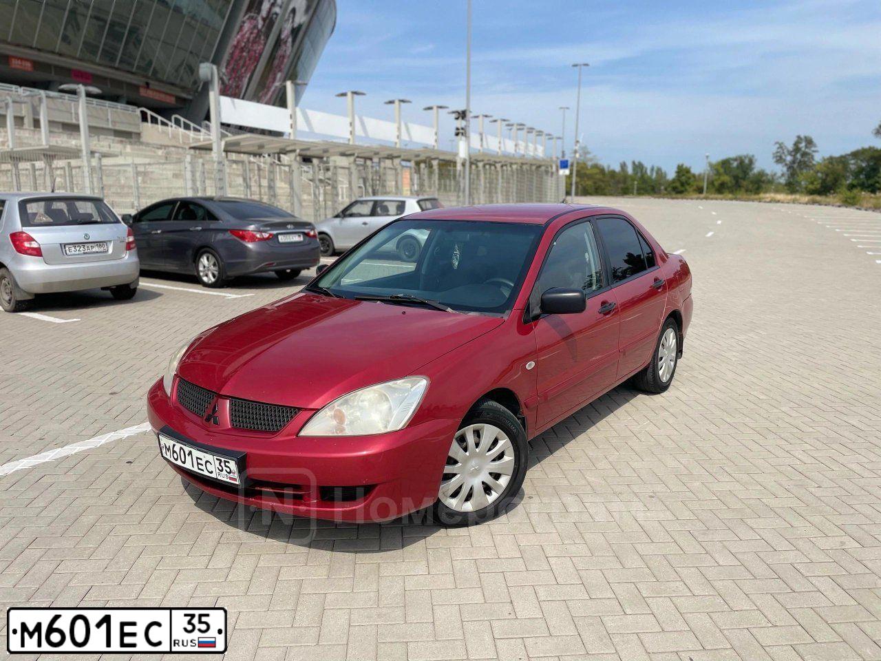 Фото автомобиля MITSUBISHI LANCER, 2006 — госномер М601ЕС35. Цвет: Красный