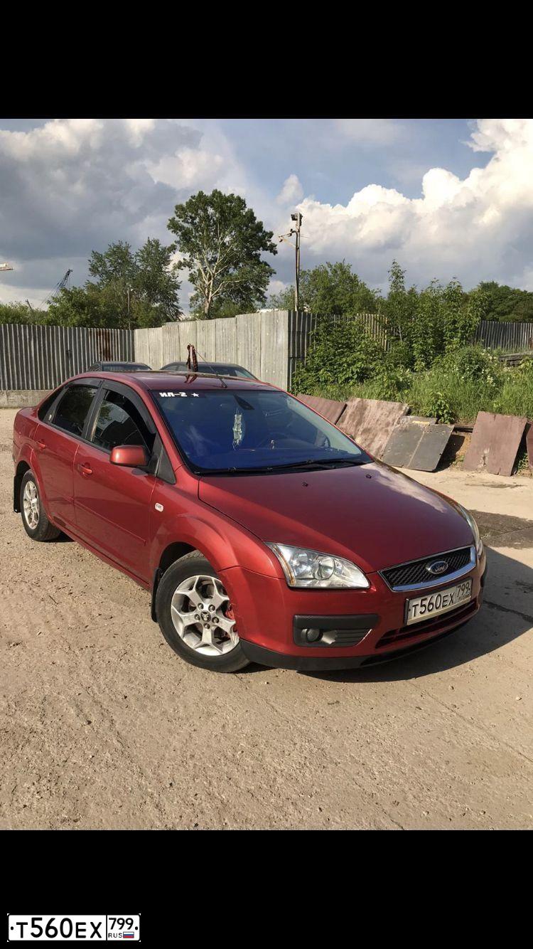 Фото автомобиля FORD FOCUS, 2005 — госномер К315СТ53. Цвет: КРАСНО-ОРАНЖЕВЫЙ