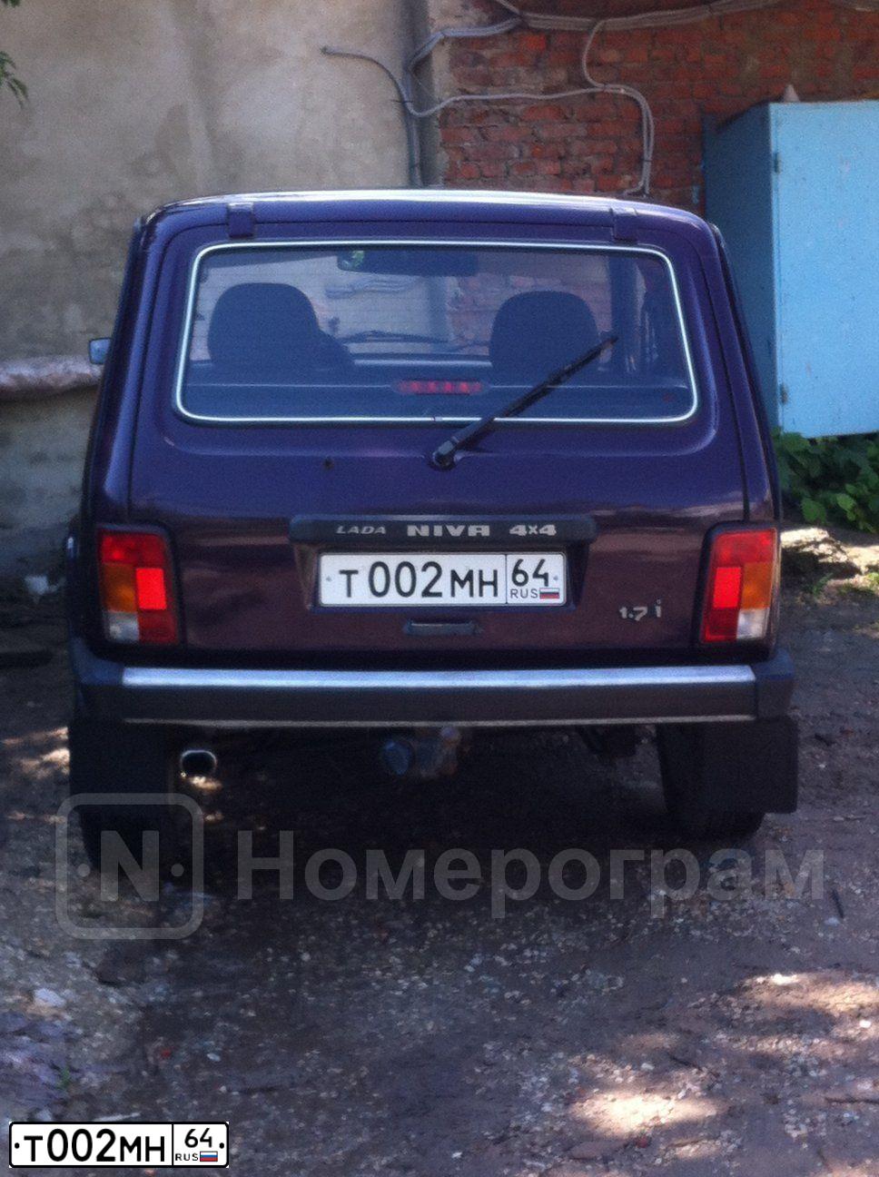 Фото автомобиля LADA 2121 NIVA, 2003 — госномер Т002МН64. Цвет: ФИОЛЕТОВЫЙ