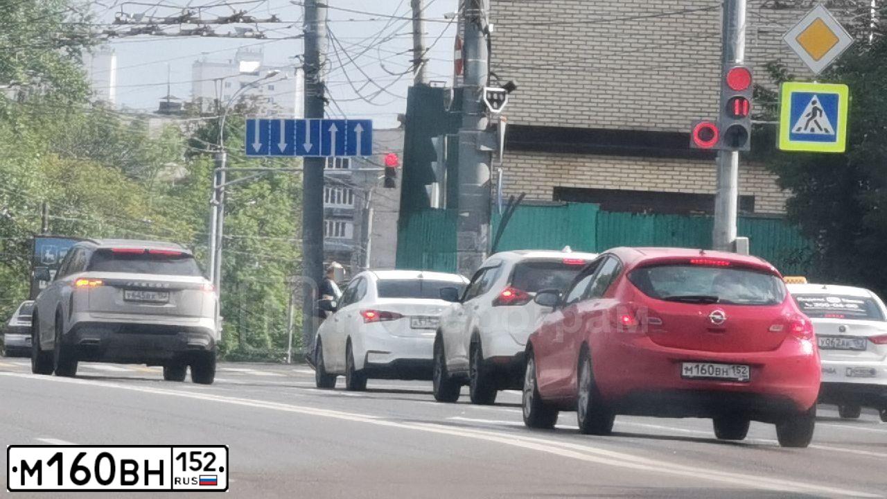 Фото автомобиля OPEL ASTRA, 2013 — госномер М160ВН152. Цвет: Красный
