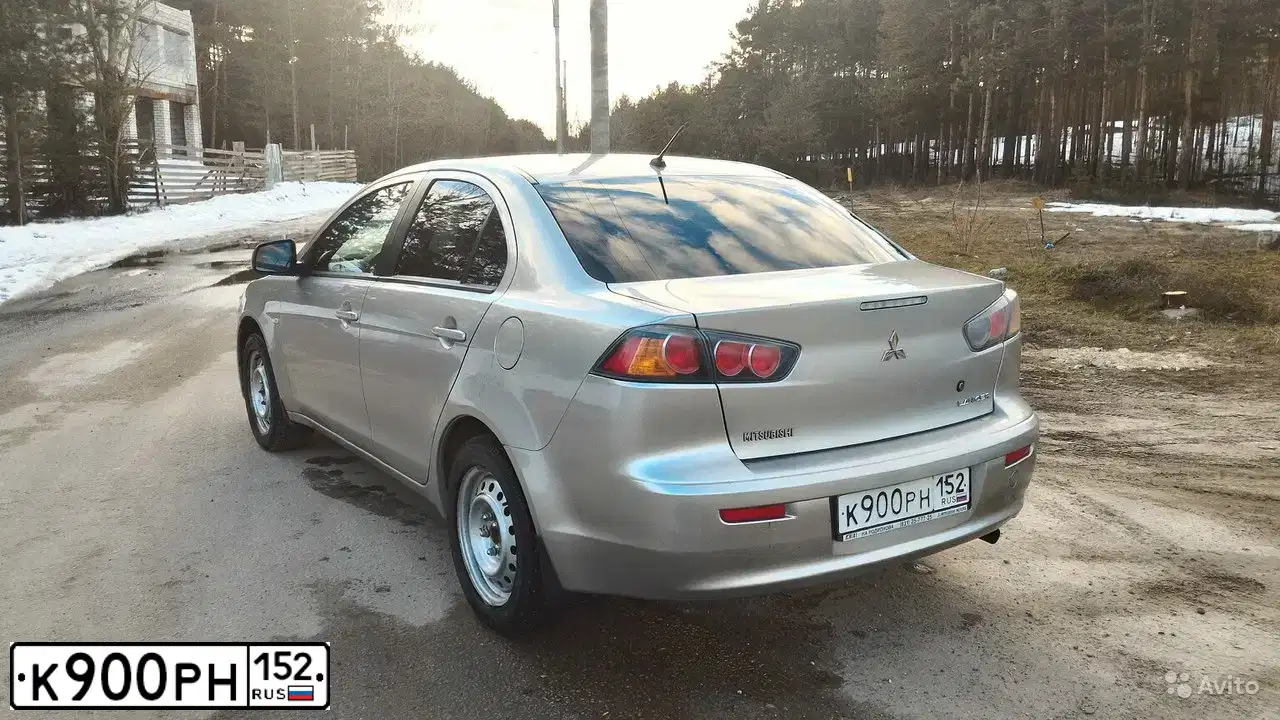 Фото автомобиля MITSUBISHI LANCER, 2012 — госномер О519ОХ152. Цвет: СВЕТЛО-СЕРЫЙ
