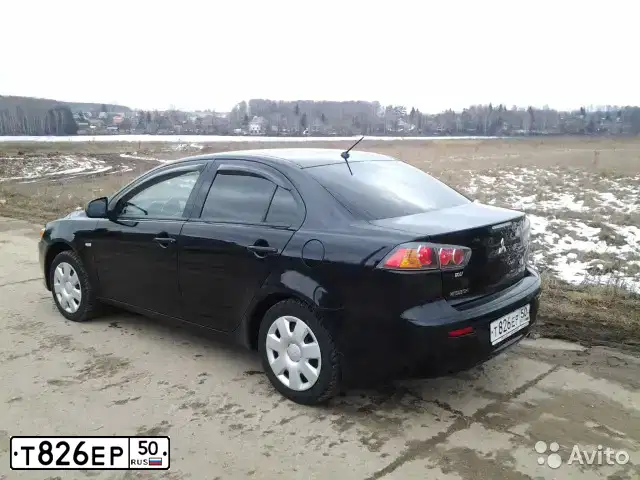 Фото автомобиля MITSUBISHI LANCER, 2011 — госномер Т826ЕР50. Цвет: ЧЕРНЫЙ