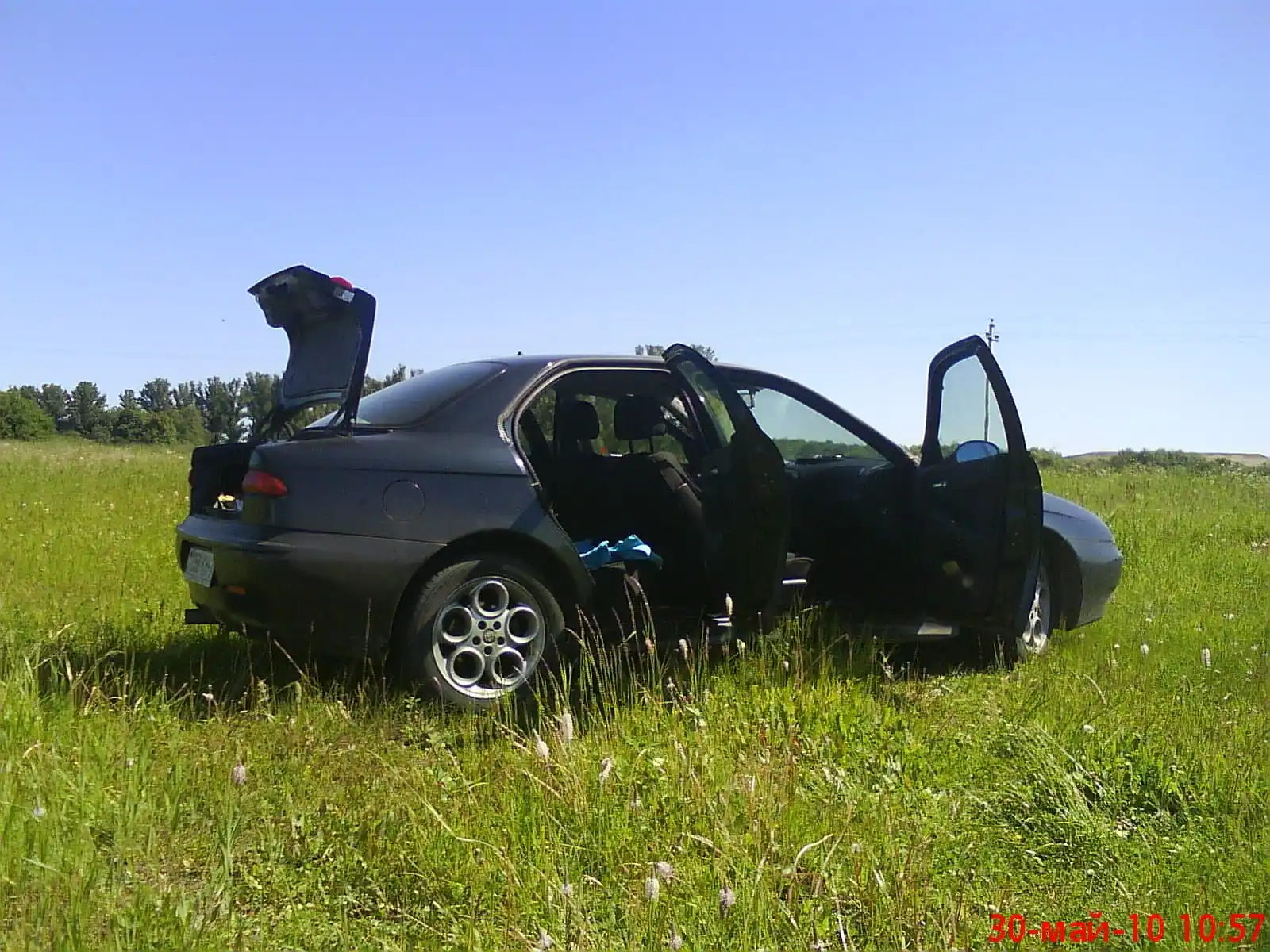 Фото автомобиля LADA 2104, 1995 — госномер Е258КН77. Цвет: Красный