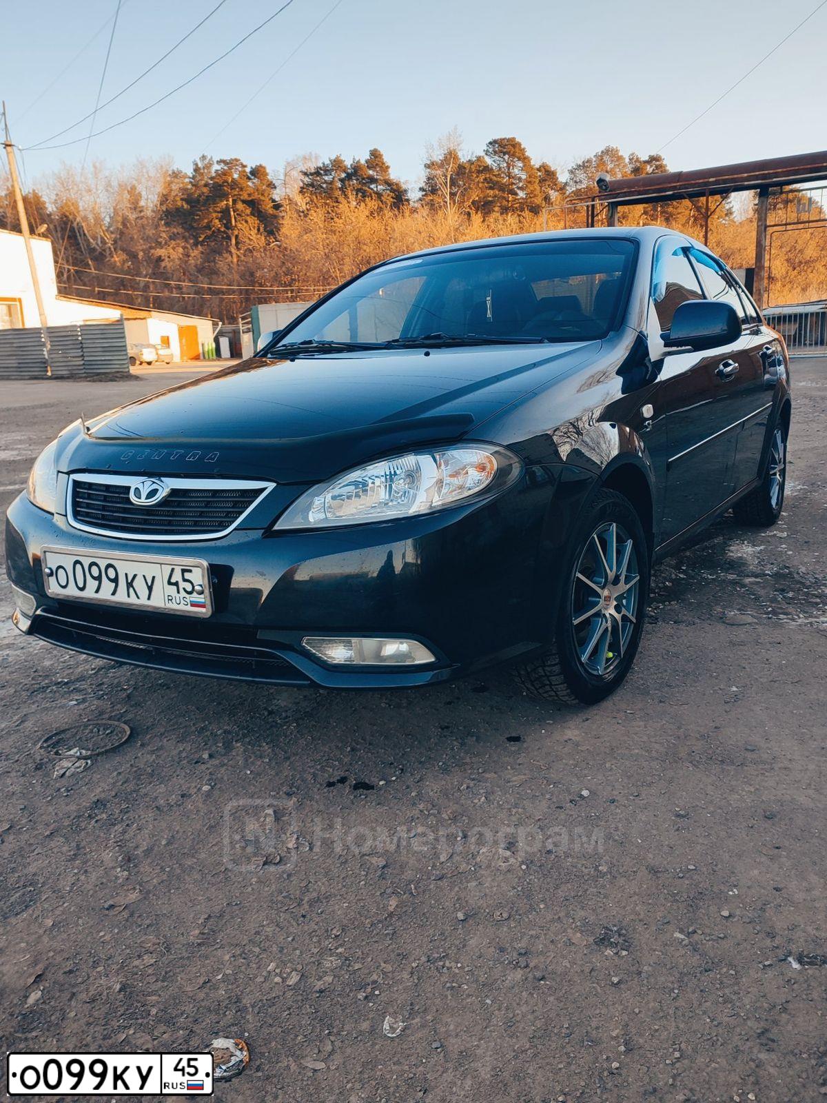 Фото автомобиля DAEWOO GENTRA, 2014 — госномер О099КУ45. Цвет: БЛЕДНО-ЧЕРНЫЙ