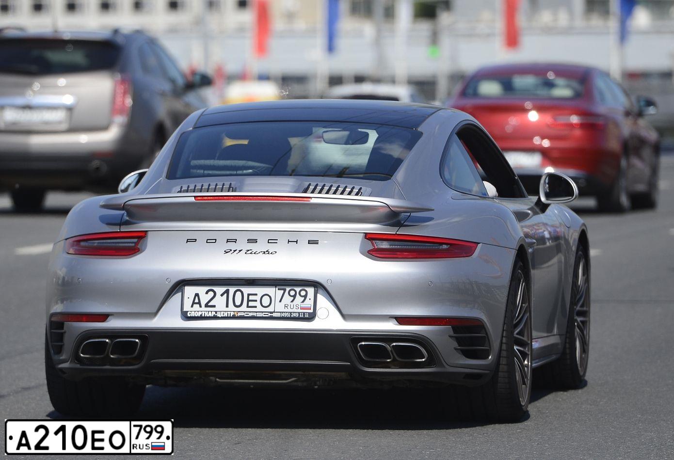 Фото автомобиля PORSCHE 911, 2017 — госномер А210ЕО799. Цвет: Серебристый