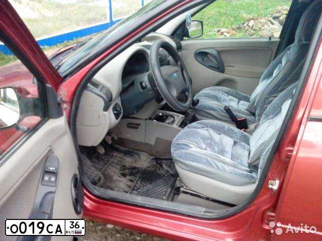 Фото автомобиля LADA 1119 KALINA, 2010 — госномер О019СА36. Цвет: СЕРЕБРИСТО-КРАСНЫЙ
