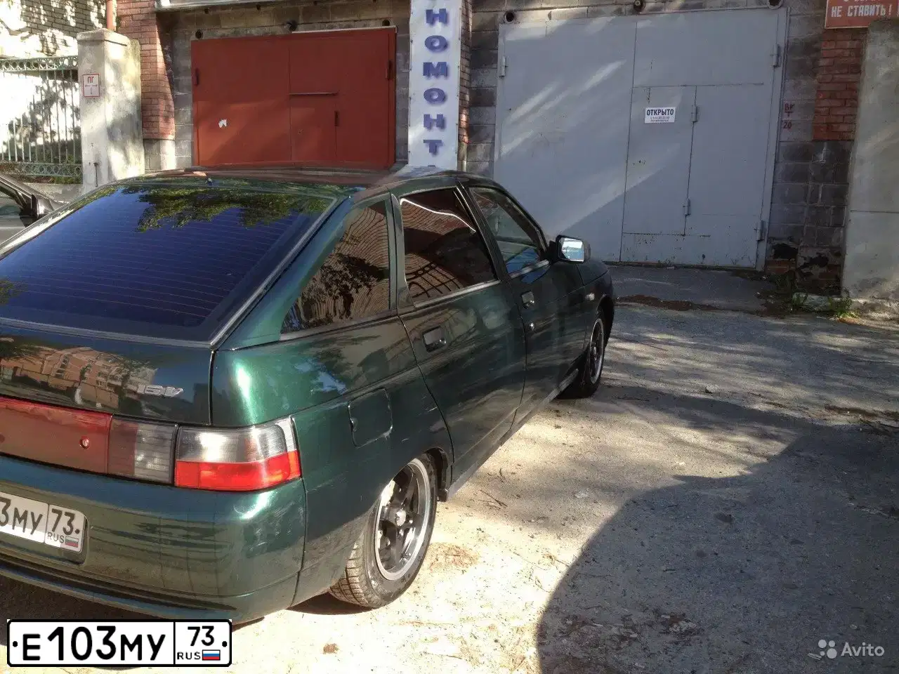 Фото автомобиля LADA 2112 LADA, 2003 — госномер Е103МУ73. Цвет: Темно-зеленый