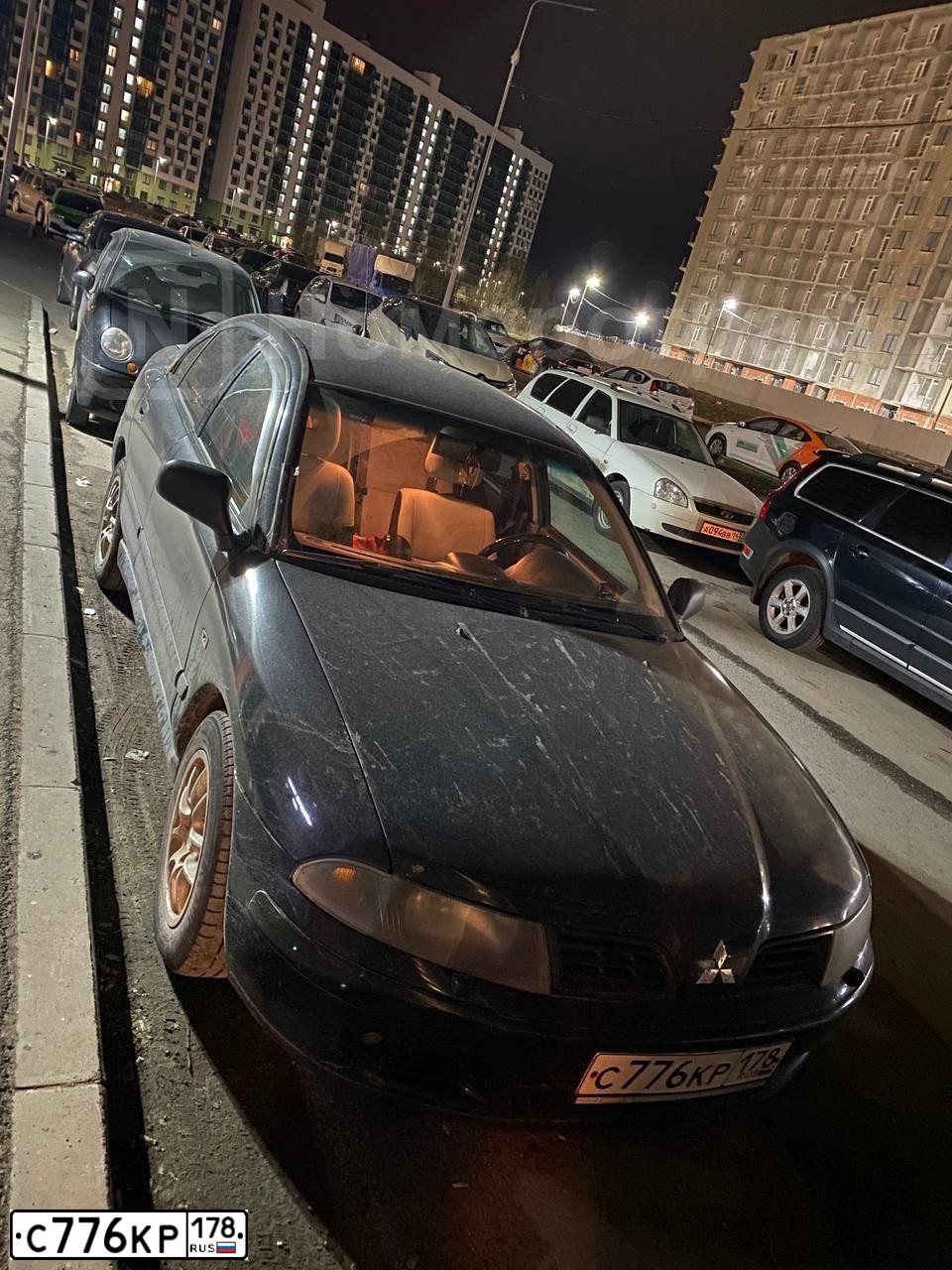 Фото автомобиля MITSUBISHI CARISMA, 2003 — госномер С776КР178. Цвет: ЧЕРНЫЙ