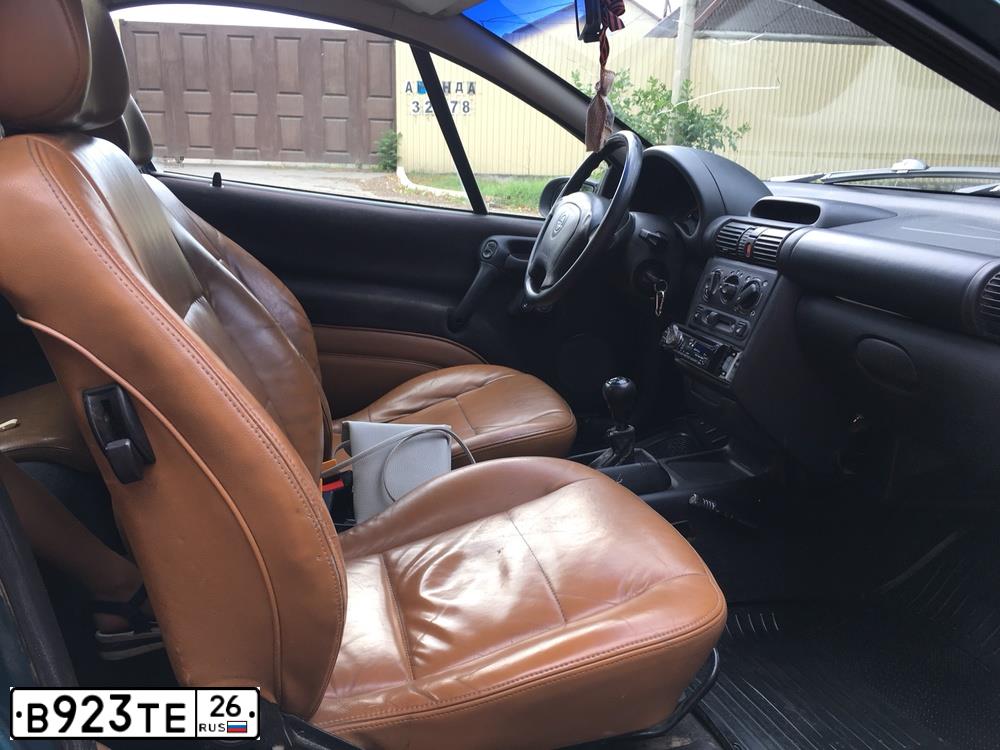 Фото автомобиля OPEL TIGRA, 1997 — госномер К142АР190. Цвет: ЗЕЛЕНЫЙ