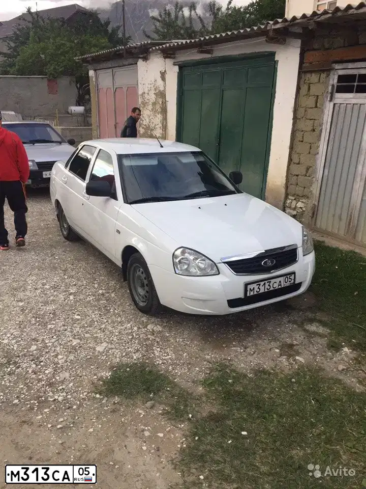 Фото автомобиля LADA 2170 PRIORA, 2013 — госномер М313СА05. Цвет: БЕЛЫЙ
