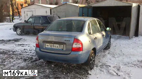Фото автомобиля LADA 1118 KALINA, 2007 — госномер М169КА55. Цвет: СЕРО-СИНИЙ