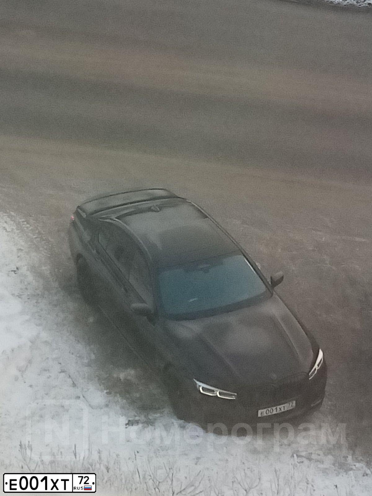 Фото автомобиля MITSUBISHI LANCER, 2007 — госномер Е001ХТ72. Цвет: КРАСНЫЙ