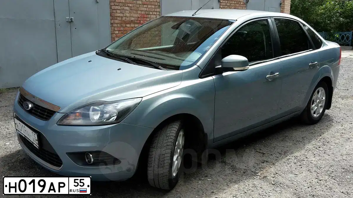 Фото автомобиля FORD FOCUS, 2009 — госномер Н019АР55. Цвет: СЕРО-ГОЛУБОЙ