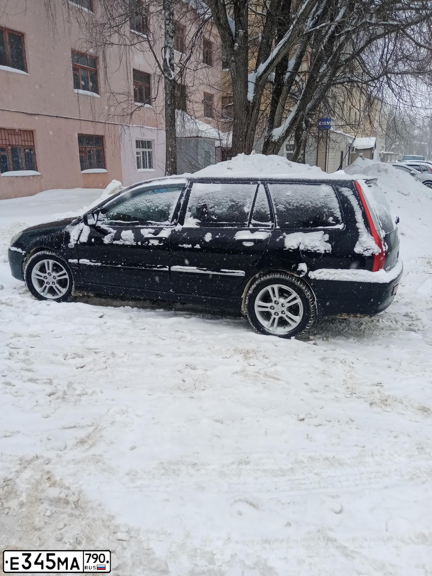 Фото автомобиля MITSUBISHI LANCER, 2004 — госномер С714СК790. Цвет: ЧЕРНЫЙ