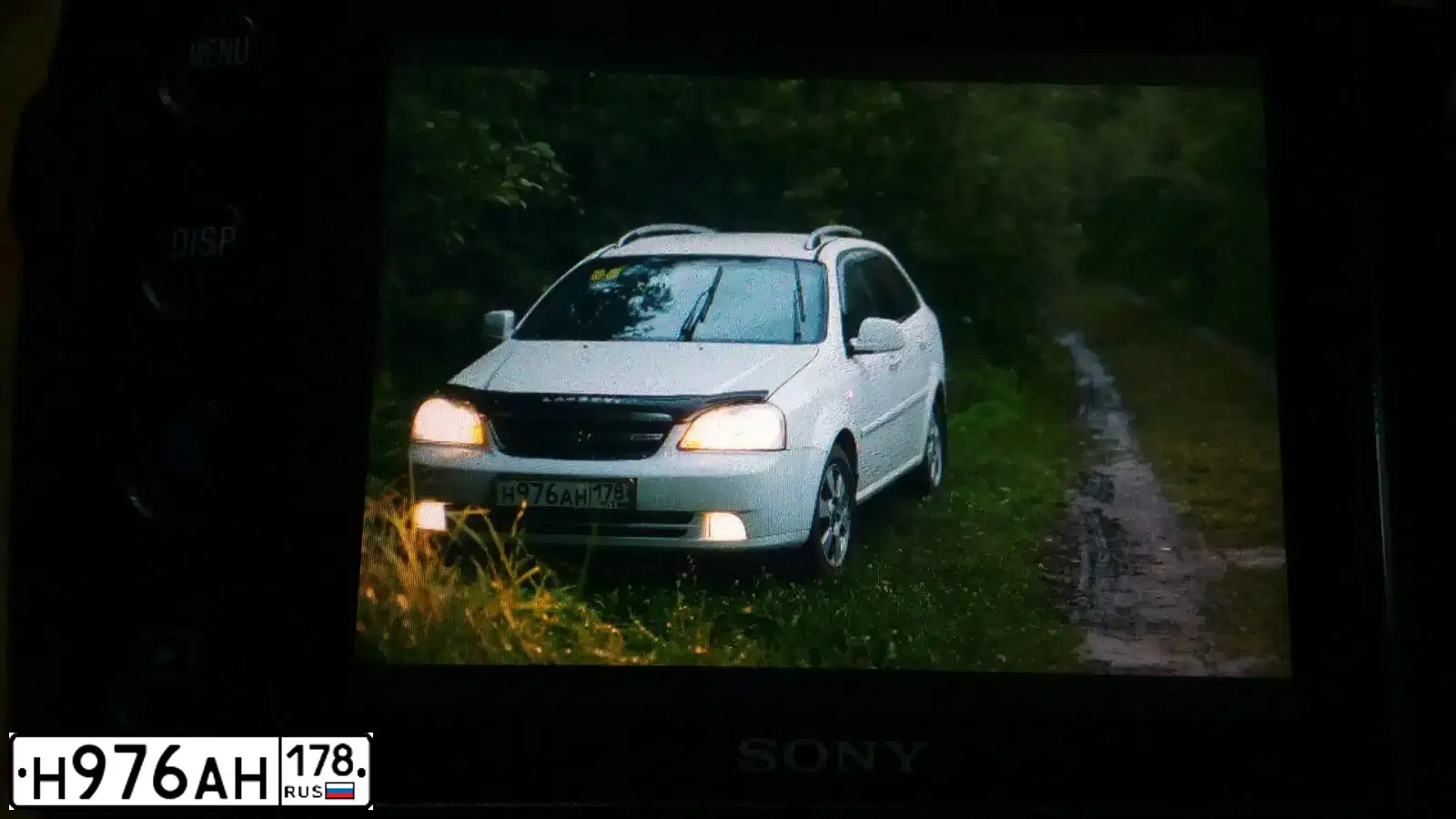Фото автомобиля CHEVROLET LACETTI, 2012 — госномер Н976АН178. Цвет: Белый