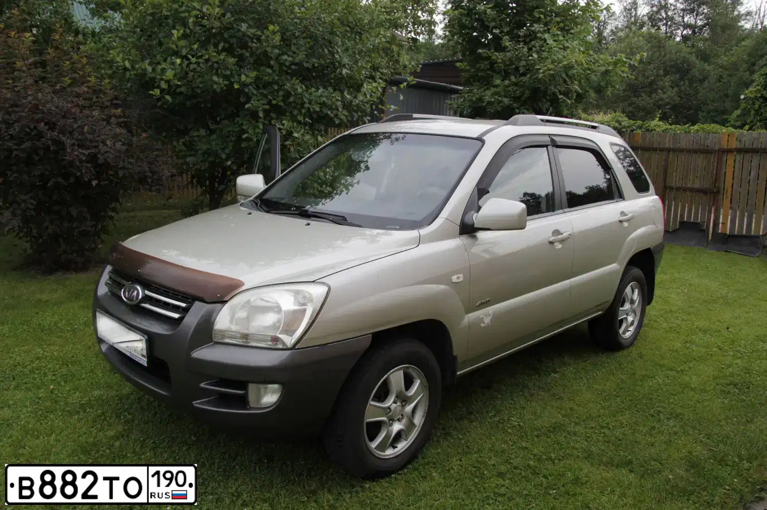 Фото автомобиля KIA SPORTAGE, 2007 — госномер Н630ХР32. Цвет: ЗОЛОТИСТЫЙ
